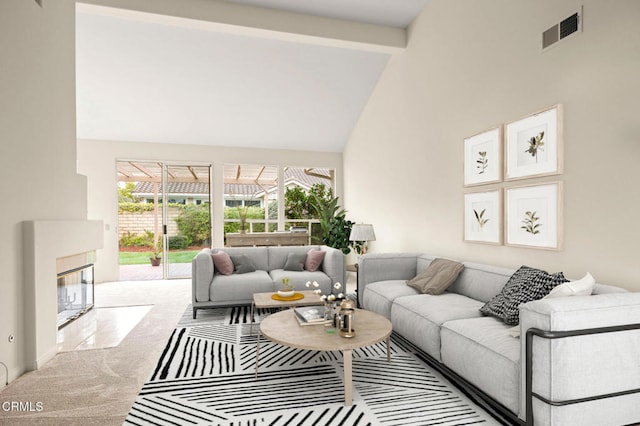 2101 Fox Den Ct, Oxnard, CA 93036 - carpeted living area featuring high vaulted ceiling, a tile fireplace, and visible vents