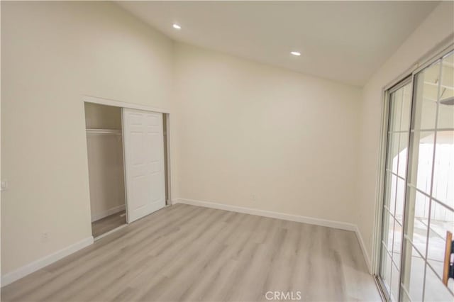 3456 Crownsworth St, Corona, CA 92879 - unfurnished bedroom with light wood finished floors, recessed lighting, a closet, baseboards, and lofted ceiling