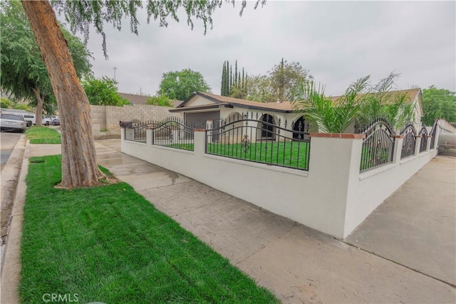 3456 Crownsworth St, Corona, CA 92879 - exterior space featuring a lawn and a fenced front yard