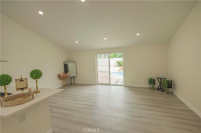 3456 Crownsworth St, Corona, CA 92879 - unfurnished living room with recessed lighting, baseboards, and light wood-style floors