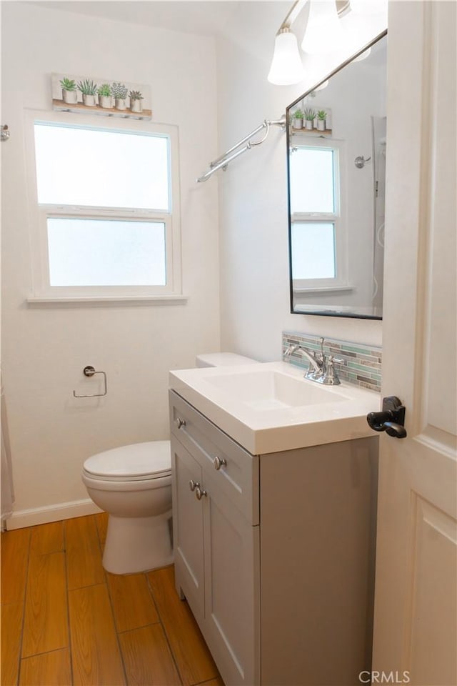 3610 Kalsman Dr Unit 2, Los Angeles, CA 90016 - bathroom with toilet, baseboards, vanity, and wood finished floors