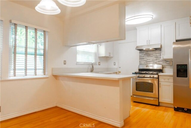 3610 Kalsman Dr Unit 2, Los Angeles, CA 90016 - kitchen featuring light wood-style floors, white cabinets, appliances with stainless steel finishes, and under cabinet range hood