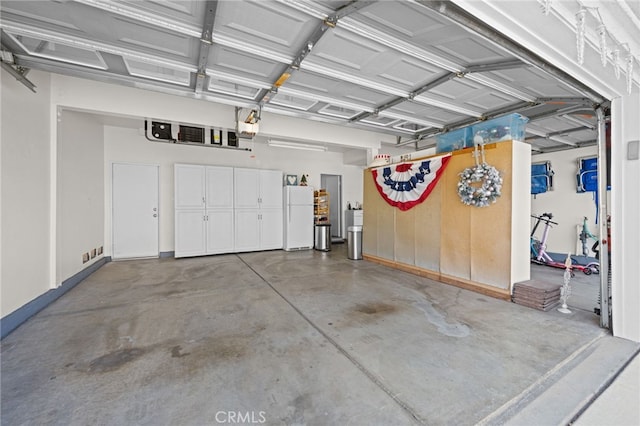 8481 Attica Dr, Riverside, CA 92508 - garage with a garage door opener and freestanding refrigerator
