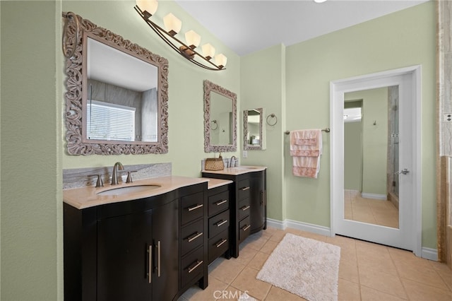 8481 Attica Dr, Riverside, CA 92508 - full bathroom featuring two vanities, tile patterned floors, a sink, and baseboards
