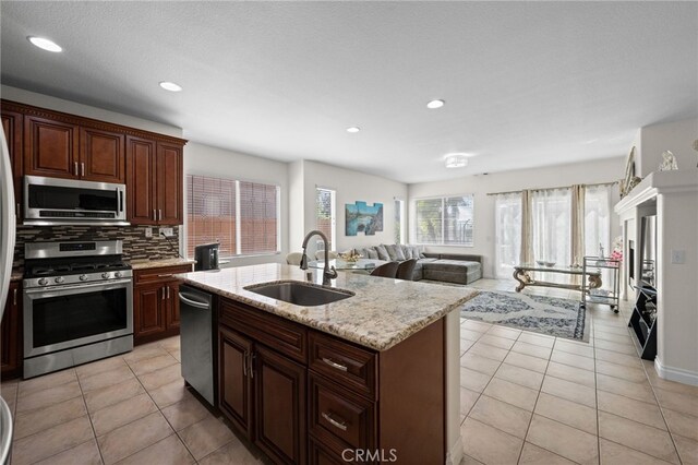 8481 Attica Dr, Riverside, CA 92508 - kitchen with appliances with stainless steel finishes, tasteful backsplash, a sink, and recessed lighting