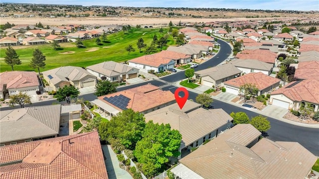 birds eye view of property with a residential view and view of golf course