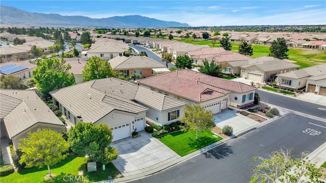 drone / aerial view with a mountain view and a residential view