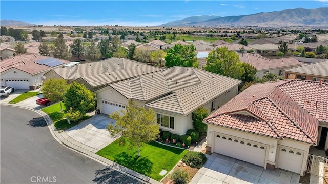 drone / aerial view with a residential view and a mountain view
