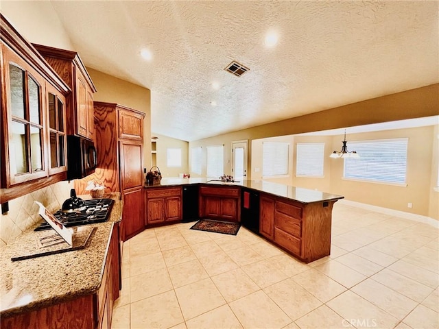 19640 Yanan Rd, Apple Valley, CA 92307 - kitchen with a peninsula, light tile patterned floors, a textured ceiling, visible vents, and black appliances