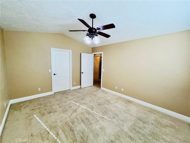 19640 Yanan Rd, Apple Valley, CA 92307 - unfurnished bedroom with baseboards, a ceiling fan, carpet floors, and vaulted ceiling
