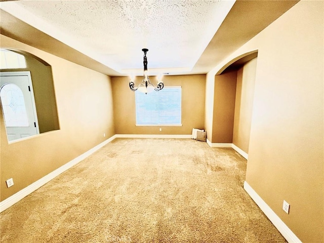 19640 Yanan Rd, Apple Valley, CA 92307 - unfurnished dining area with baseboards, arched walkways, and carpet floors