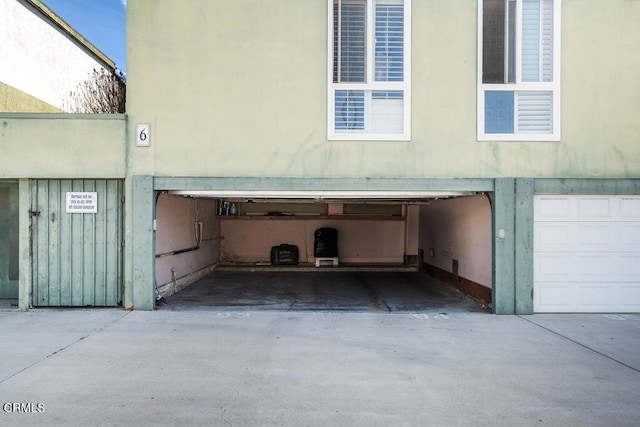 garage with concrete driveway