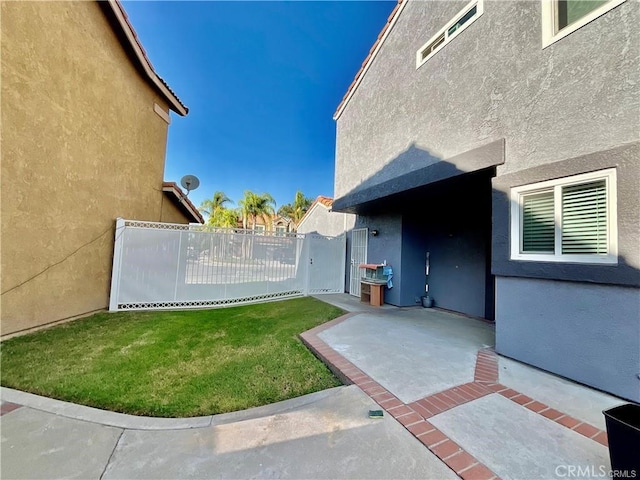 14679 Cinnamon Dr, Fontana, CA 92337 - view of yard featuring a patio and fence