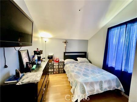 14679 Cinnamon Dr, Fontana, CA 92337 - bedroom featuring light wood finished floors