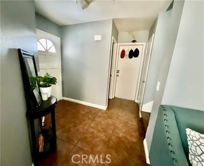 14679 Cinnamon Dr, Fontana, CA 92337 - interior space with dark tile patterned floors and baseboards