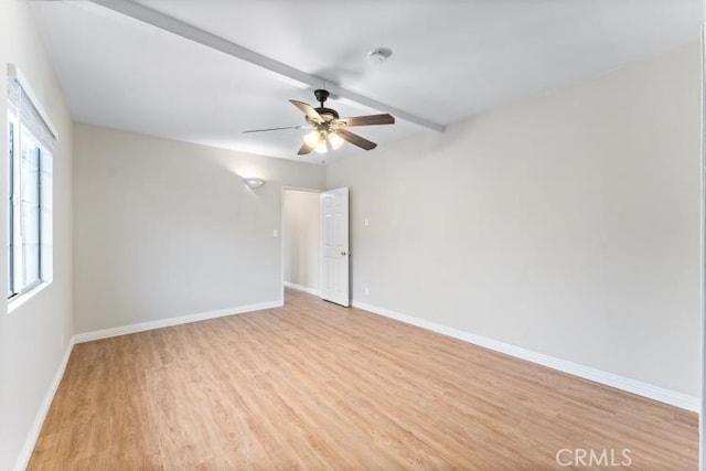 unfurnished room with a ceiling fan, baseboards, and light wood-style floors