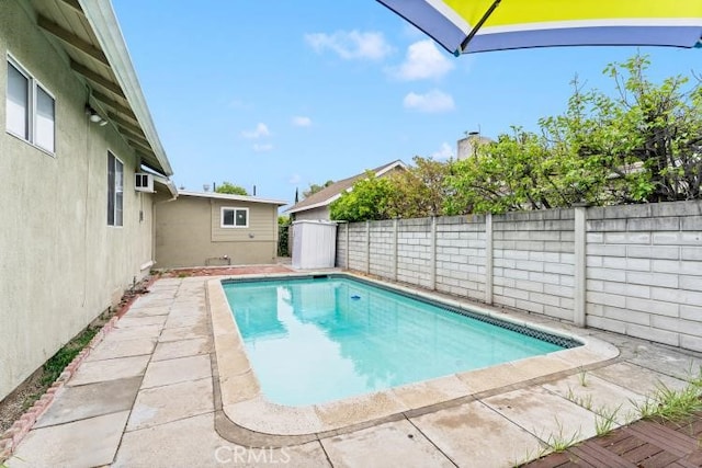 view of pool with a fenced backyard, a patio area, and a fenced in pool