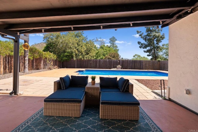 view of patio / terrace featuring an outdoor living space, a fenced backyard, and a fenced in pool
