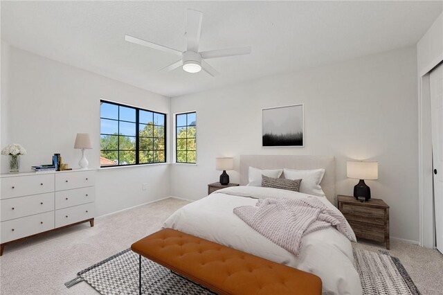 bedroom with baseboards, carpet flooring, and ceiling fan