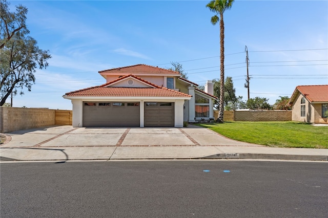 view of front of property with driveway, a front yard, a tile roof, a garage, and fence
