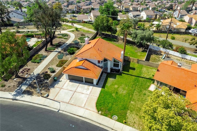 birds eye view of property with a residential view