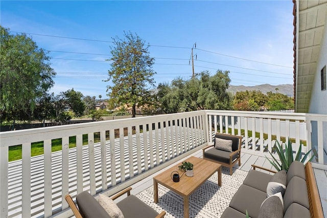 wooden deck featuring a mountain view