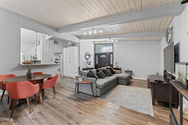 19459 Lull St, Reseda, CA 91335 - living room with beamed ceiling, light wood-style floors, and baseboards