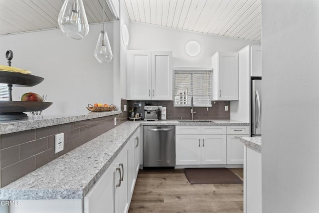 19459 Lull St, Reseda, CA 91335 - kitchen featuring appliances with stainless steel finishes, a sink, white cabinets, tasteful backsplash, and wood ceiling