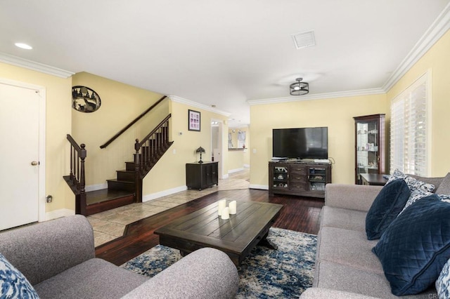 living area with wood finished floors, stairway, and crown molding