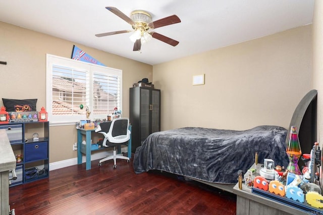 bedroom with baseboards, wood finished floors, and ceiling fan