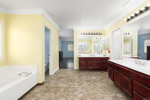 bathroom featuring a garden tub, toilet, a sink, and visible vents