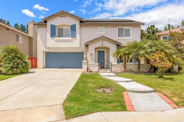 view of front of property featuring solar panels, driveway, an attached garage, a front yard, and stucco siding