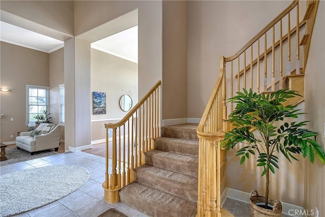 24932 Normans Way, Calabasas, CA 91302 - stairs with a high ceiling, ornamental molding, and tile patterned flooring