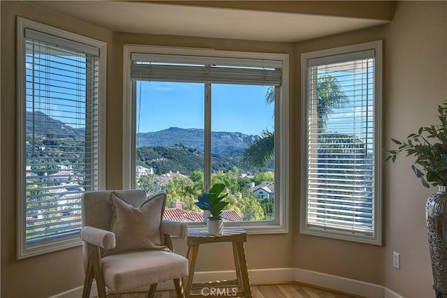 24932 Normans Way, Calabasas, CA 91302 - sitting room with a mountain view, healthy amount of natural light, and wood finished floors