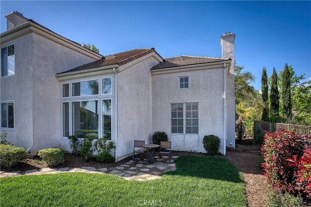 24932 Normans Way, Calabasas, CA 91302 - back of property featuring stucco siding, a patio, and a chimney