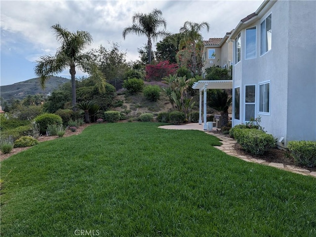 24932 Normans Way, Calabasas, CA 91302 - view of green lawn featuring a pergola, a patio, and a mountain view