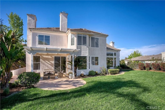 24932 Normans Way, Calabasas, CA 91302 - back of house featuring a chimney, stucco siding, a patio area, a yard, and a pergola