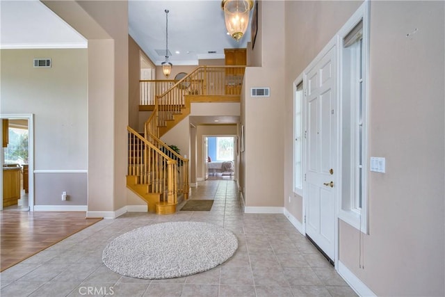 24932 Normans Way, Calabasas, CA 91302 - tiled foyer with a towering ceiling, stairway, and ornamental molding