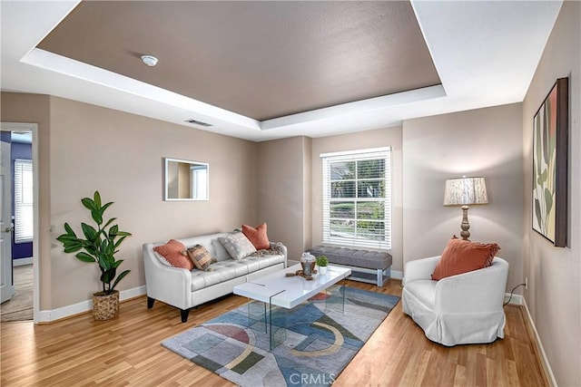 24932 Normans Way, Calabasas, CA 91302 - living area featuring a raised ceiling and wood finished floors