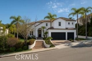 24932 Normans Way, Calabasas, CA 91302 - view of front of home with an attached garage and driveway