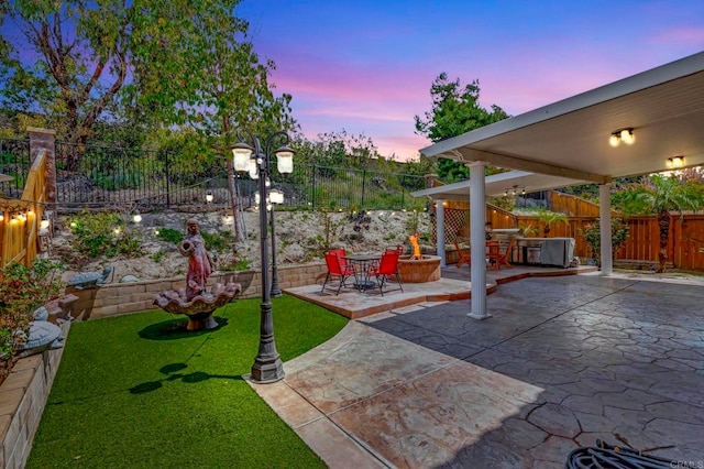 1685 Brezar St, Chula Vista, CA 91913 - yard at dusk with a patio and a fenced backyard