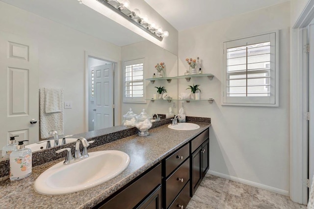 1685 Brezar St, Chula Vista, CA 91913 - bathroom featuring baseboards and double vanity