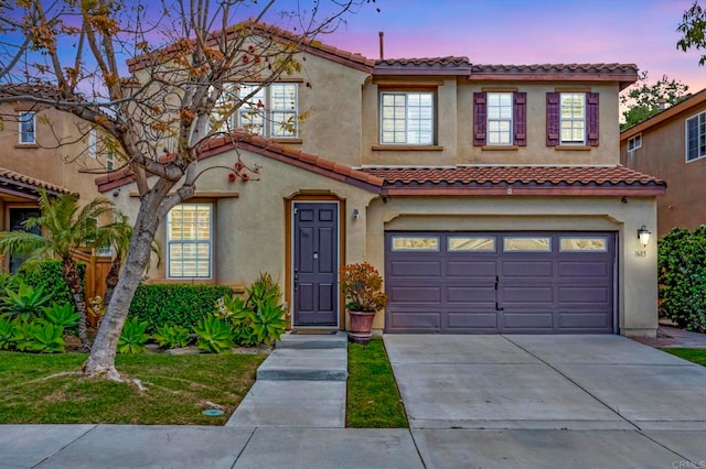 1685 Brezar St, Chula Vista, CA 91913 - mediterranean / spanish home featuring a garage, driveway, a tiled roof, and stucco siding