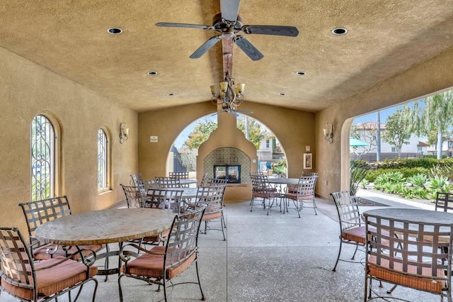 1685 Brezar St, Chula Vista, CA 91913 - view of patio featuring a multi sided fireplace, outdoor dining area, and a ceiling fan