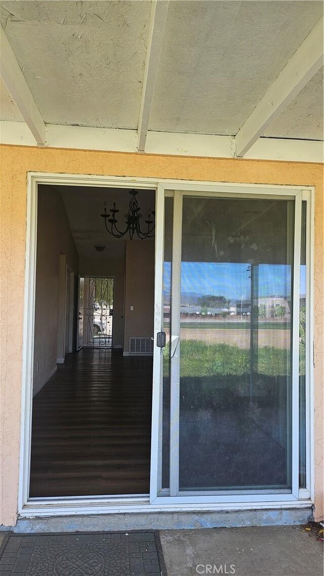 property entrance with visible vents