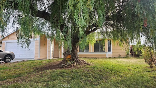 view of side of property with a yard