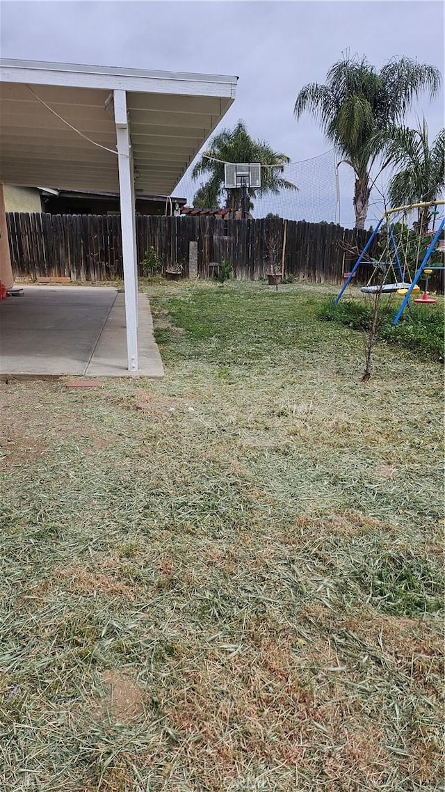 view of yard with a patio area and a fenced backyard