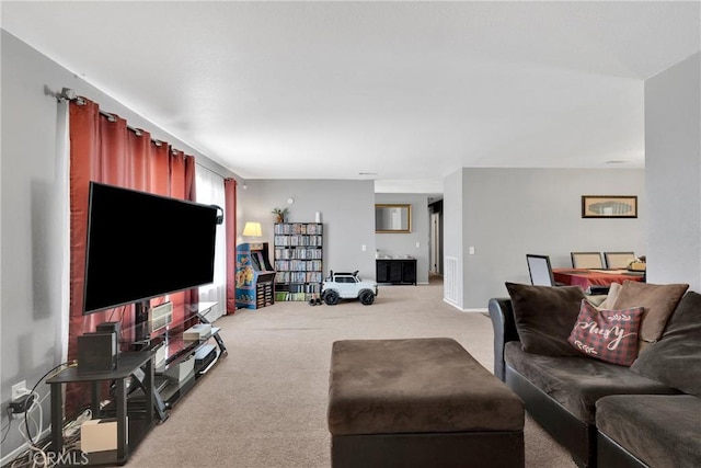 living area featuring light colored carpet
