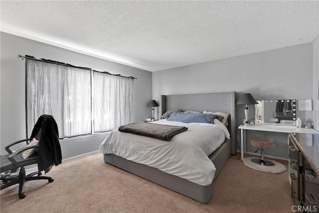 carpeted bedroom featuring a textured ceiling and baseboards