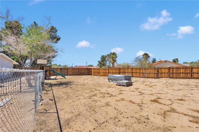 15895 Mandan Rd, Apple Valley, CA 92307 - fenced backyard with a playground
